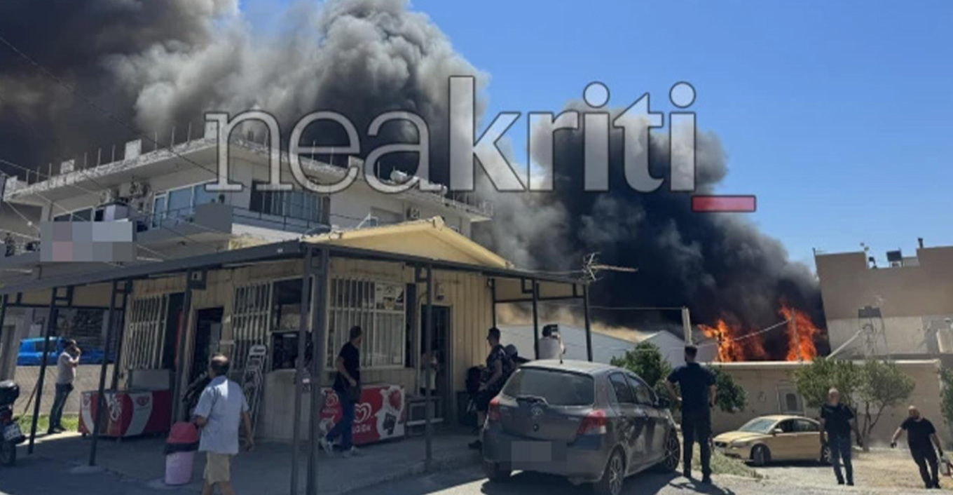 Houses are burning in Heraklion following a factory fire; smoke has engulfed the area