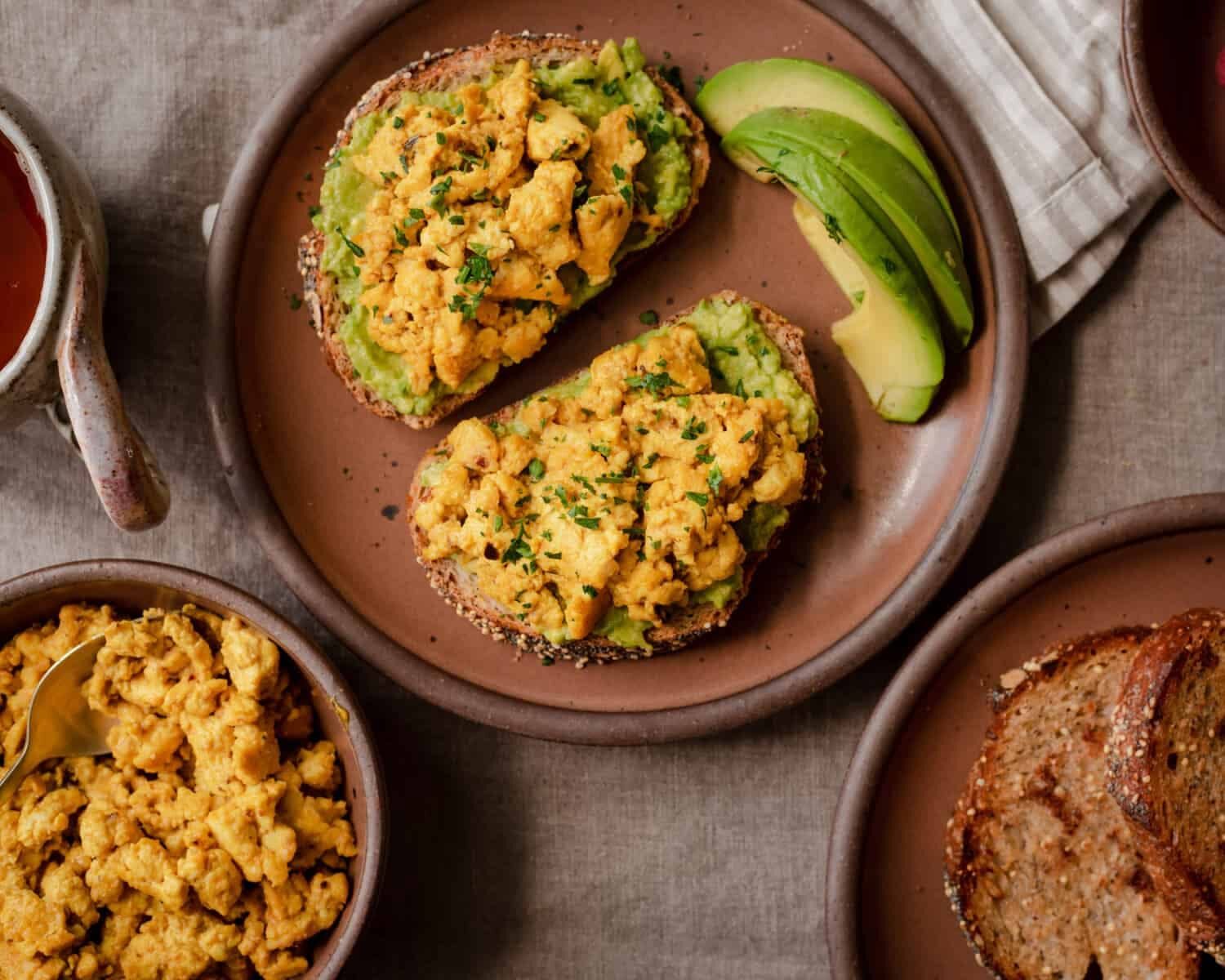 Scrambled eggs with sourdough bread and avocado