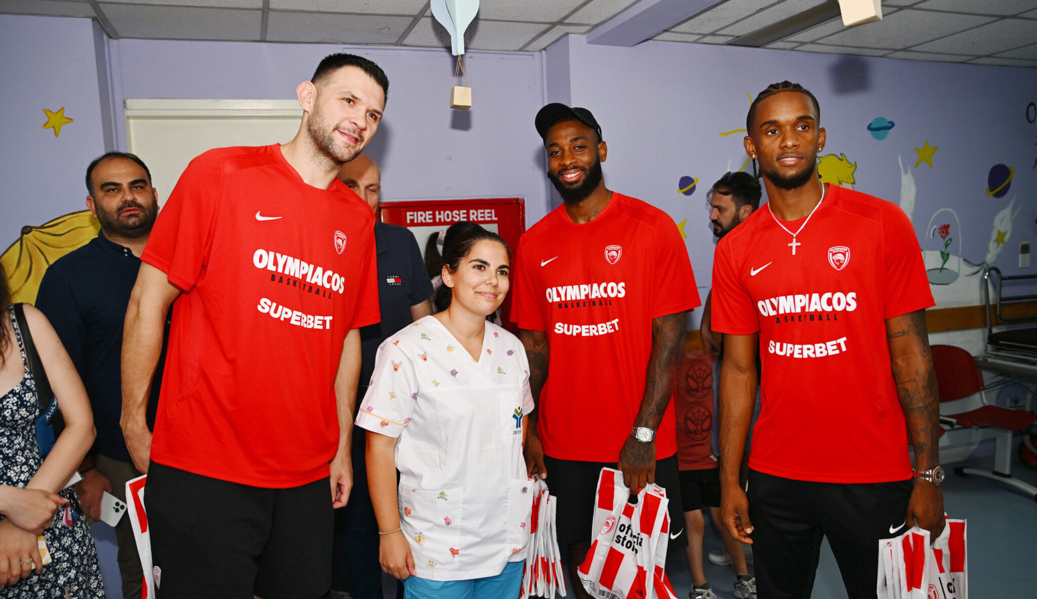 Olympiacos: Papanikolaou, Montero, and Miller-McIntyre at the Makareios Children’s Oncology Center