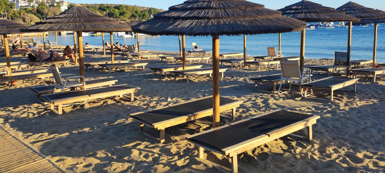The 21-year-old woman was also arrested in connection with the violent altercation over a beach chair in Vouliagmeni, where an 82-year-old man lost his life