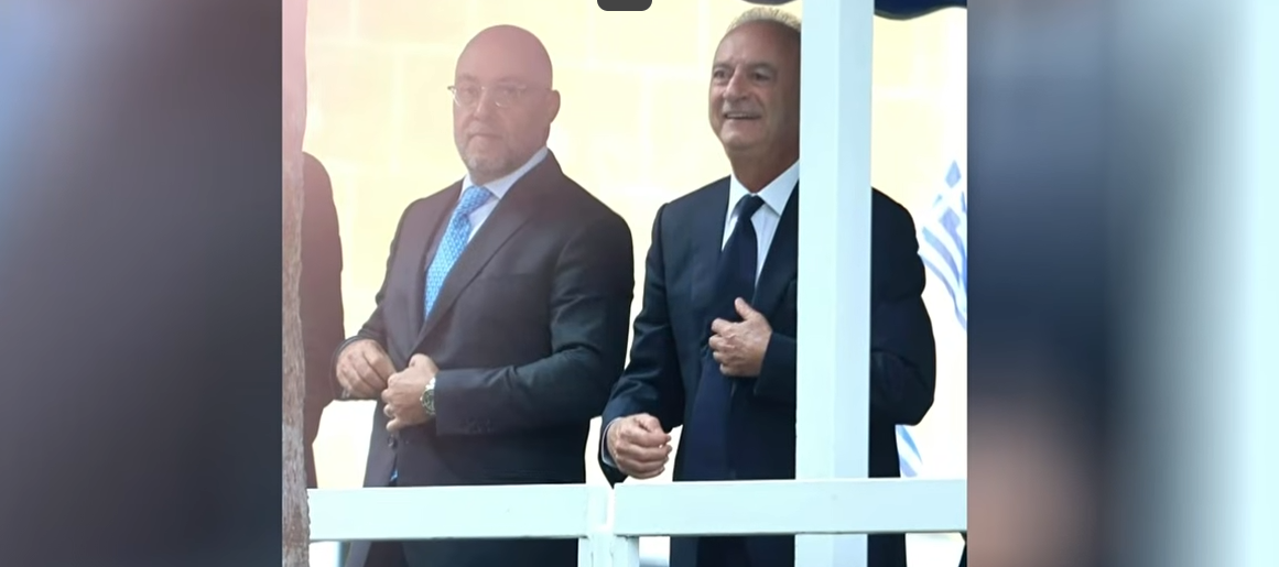 Pamporidis and averof stand side by side in the parade, but unity remains elusive in the “battered” DISY
