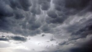 With rain and thunderstorms expected, temperatures are dropping, and dust persists